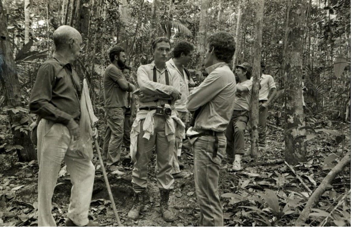 Tom and Brazilian friends in the forest, 1985.  Front left: Angelo Machado, Tom, Anthony Rylands, and in the back leaning on the tree, Celio Valle