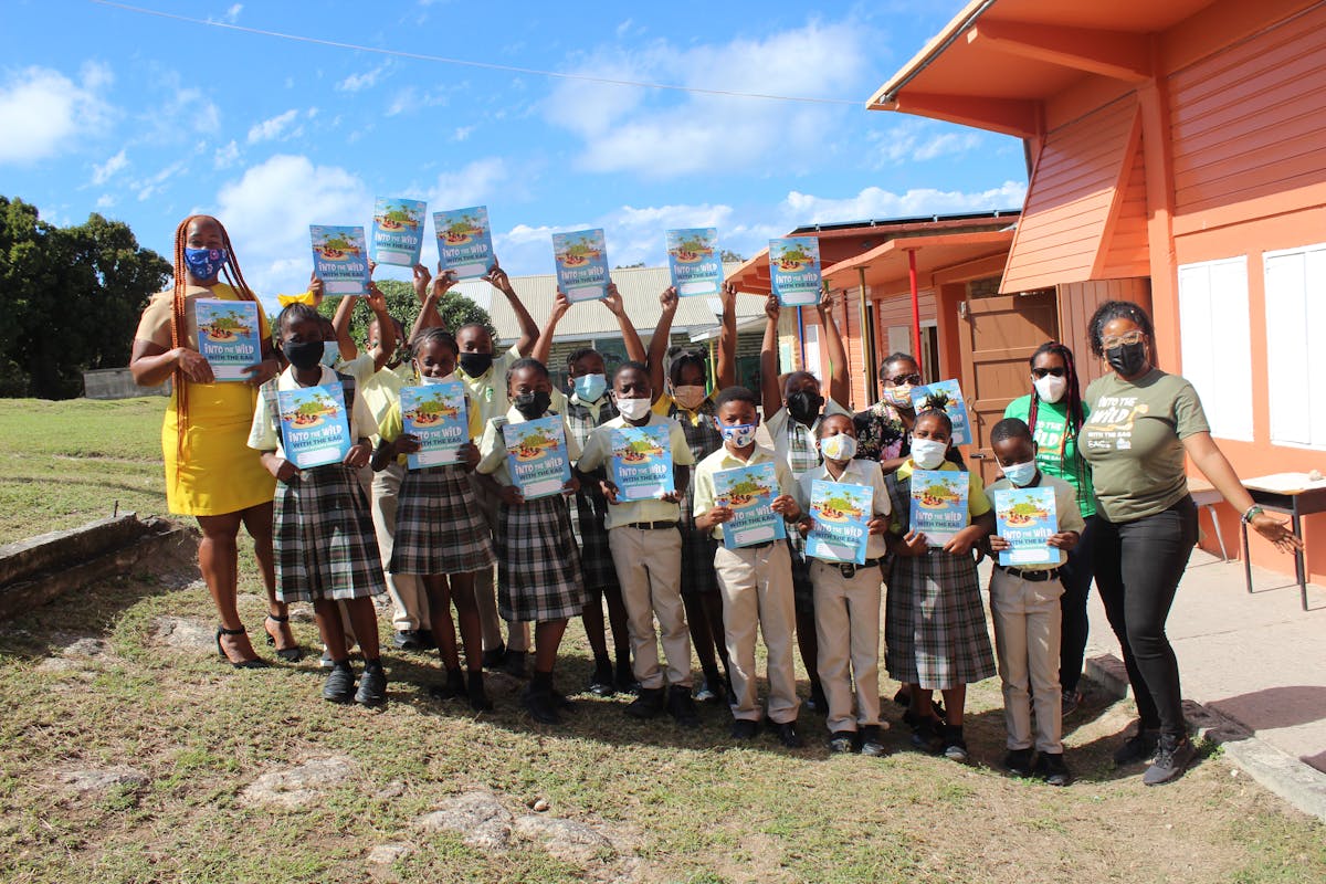 Students at New Winthorpes Primary with copies of "Into the Wild," distributed by EAG. (Johnella Bradshaw/EAG