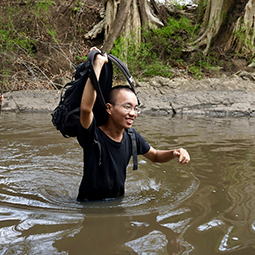 An Nguyen waist deep in water