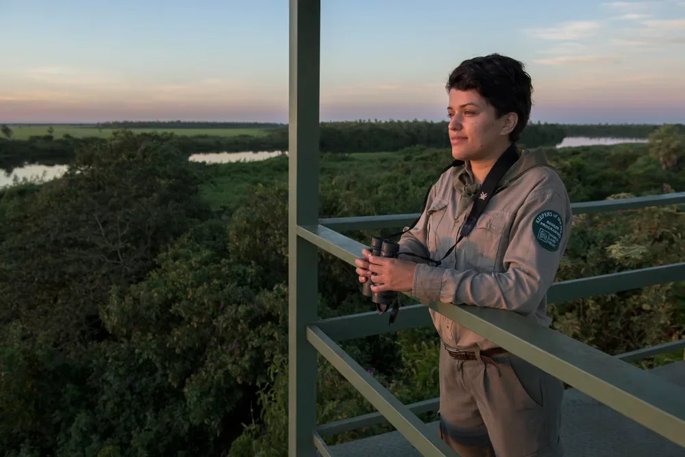 person standing on a lookout point in mesoamerica